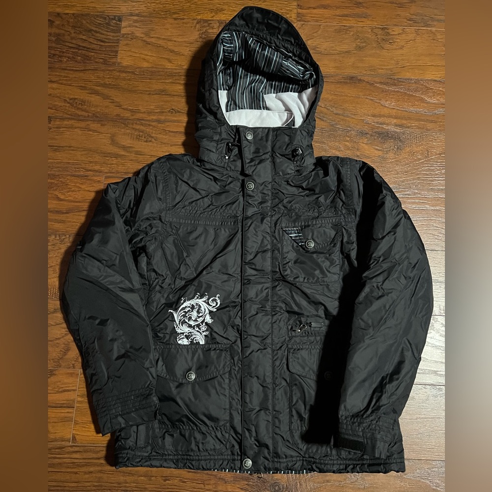 Navy blue ski jacket. The brand is Sims.